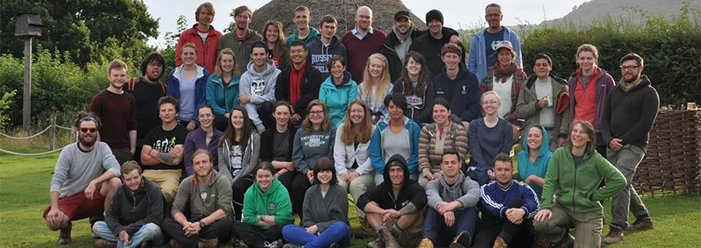 Group of archaeological field school students standing together smiling