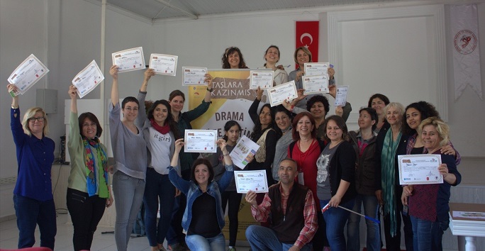 teachers posing with their certificates after taking part in the carved in stone research project