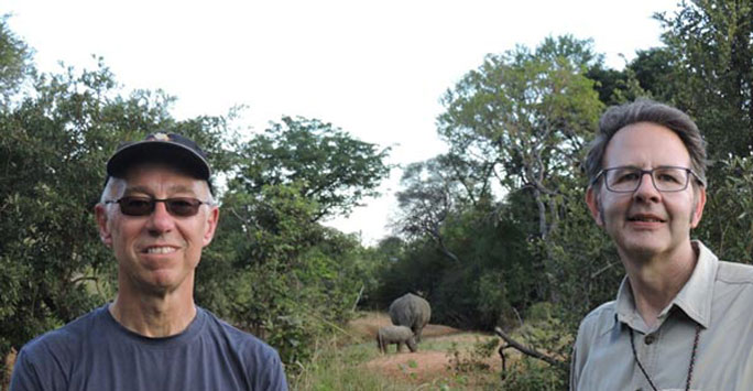 Dave Thomas and Larry (right) encounter a white rhino with her calf.