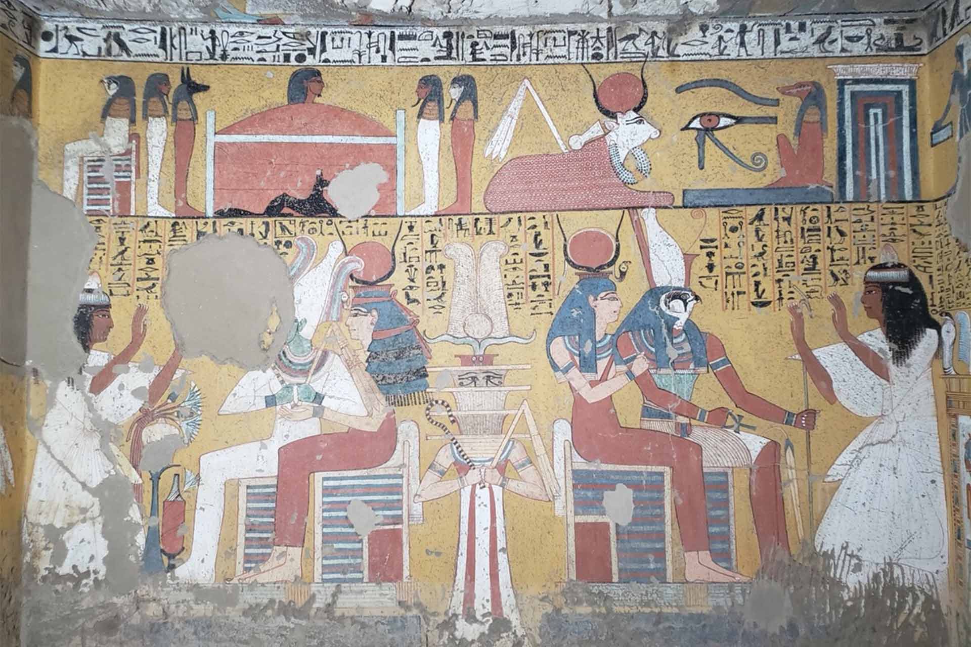 An old wall with Egyptian images showing people worshipping gods.