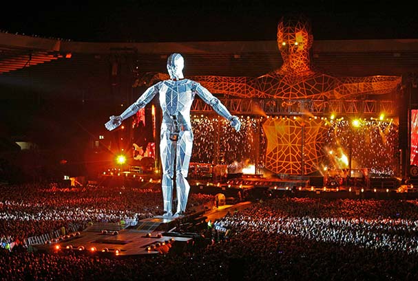 Sculpture of a male human body in metal at a rock concert