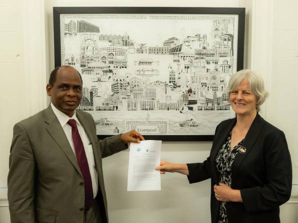 Professor Olukoju and Professor Fiona Beveridge holding the MoU