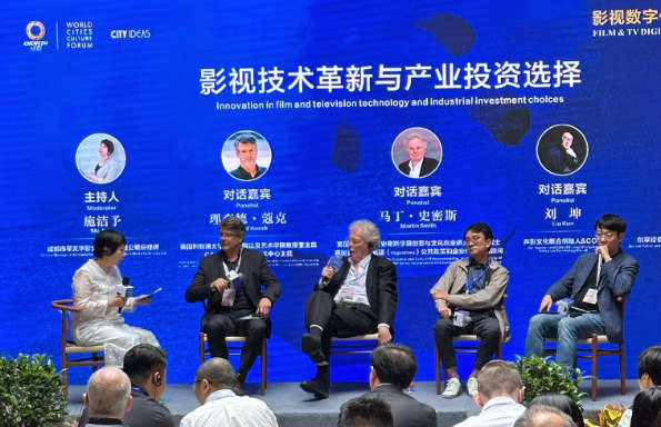 A Chinese woman interviewing two European men and two Chinese men on stage at the World Cities Culture Forum.