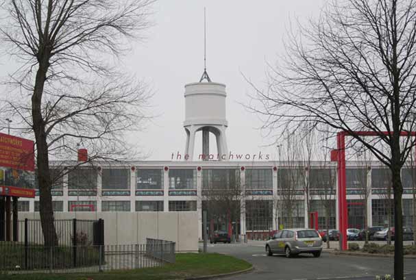 Refurbished match factory with water tower behind in Garston Liverpool