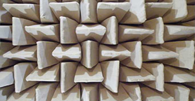 Close up of rectangular foam pyramids used in the wall of an anechoic chamber.