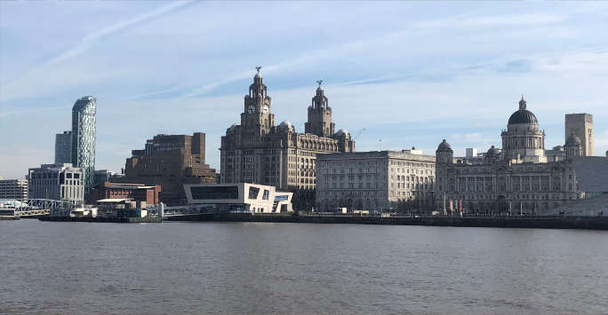 The waterfront of Liverpool showing the Three Graces, Liverpool museum and the ferry landing stage.