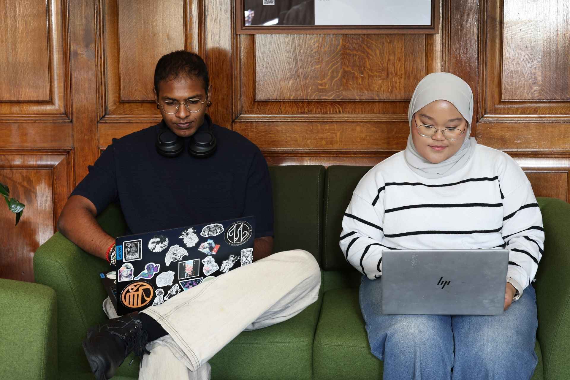 Students sitting side by side on library