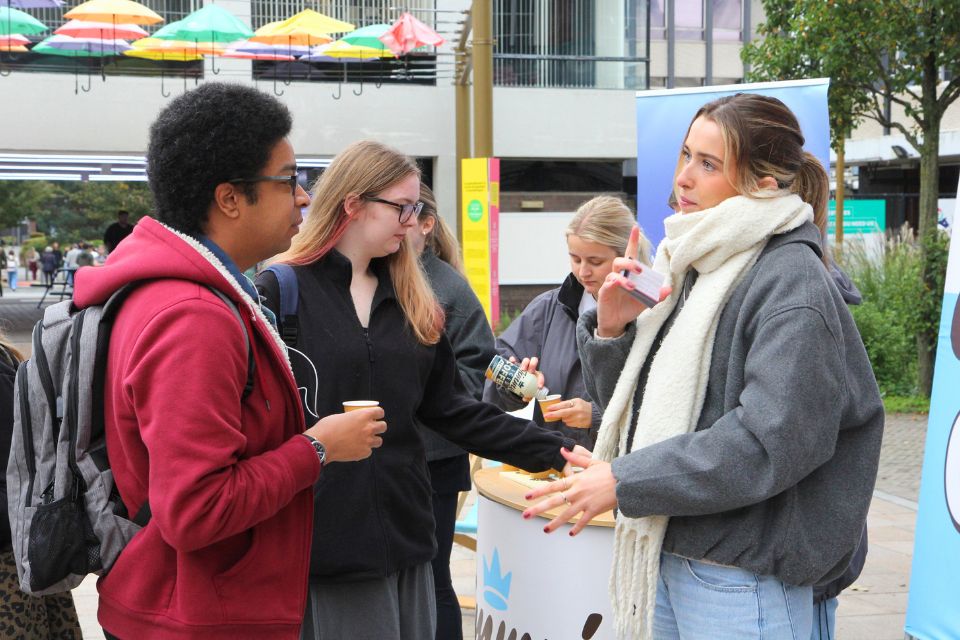 Employer engaging with students on campus