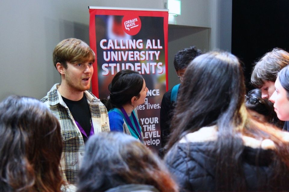 Employer stand and an employer talking to students