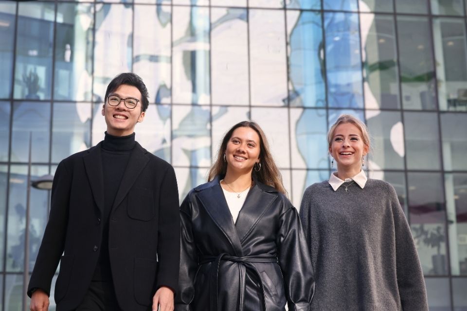 students looking at the camera and smiling