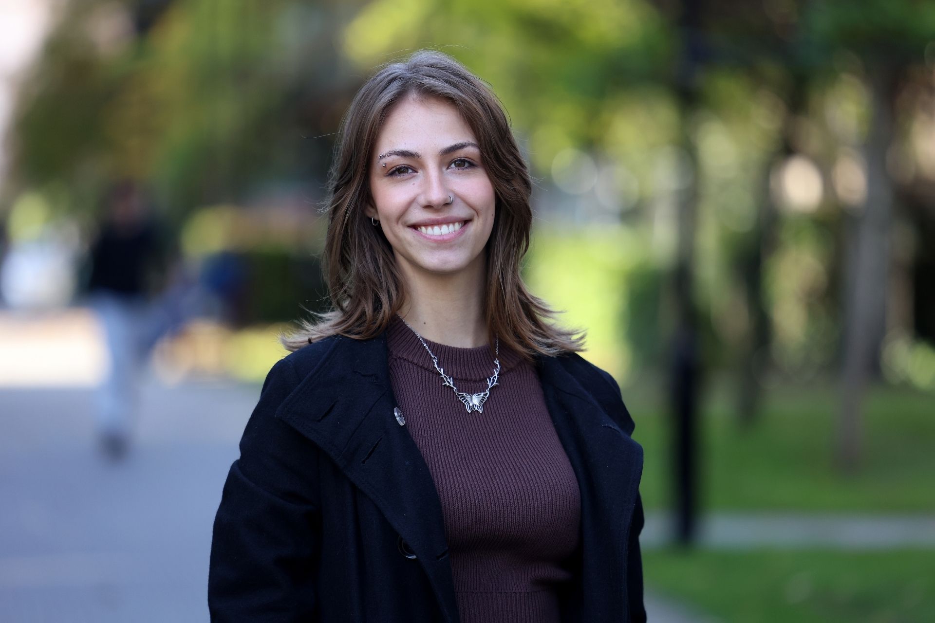 a student looking at the camera on campus