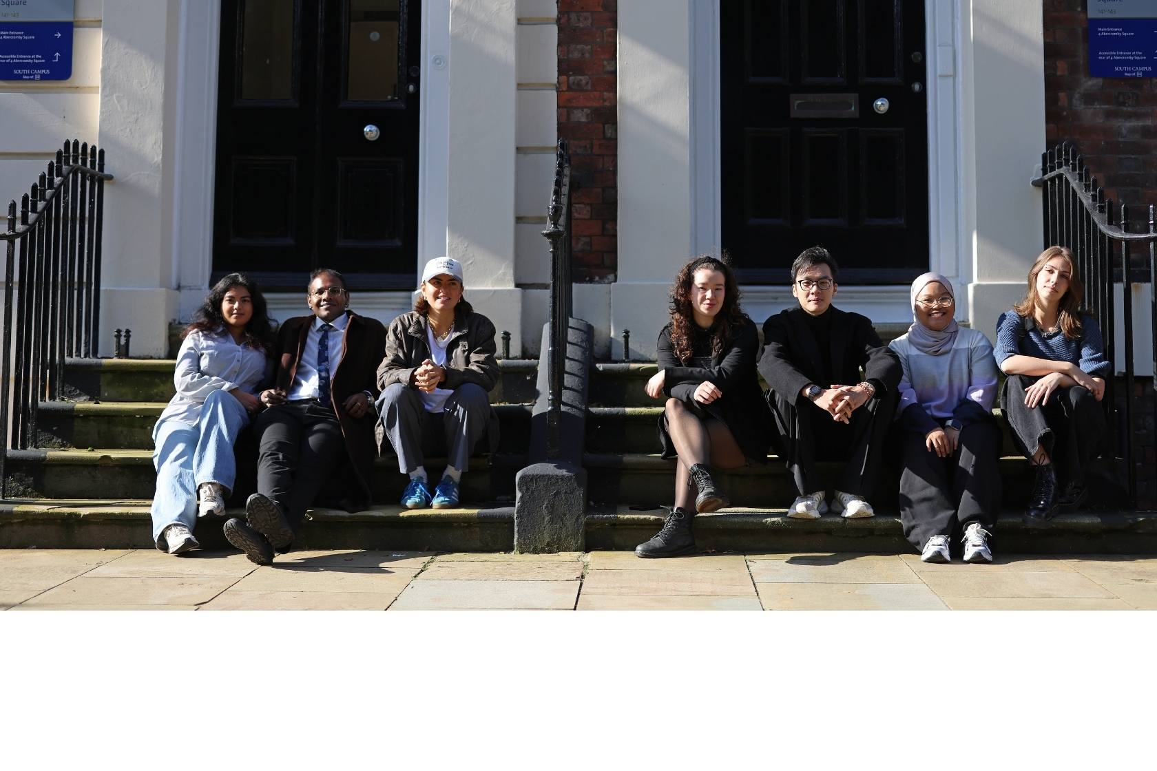 A group of international students attending a career skills workshop at the University of Liverpool, engaging in interactive activities.