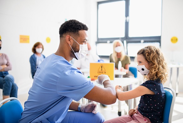 A nurse preps a patient arm for an injection