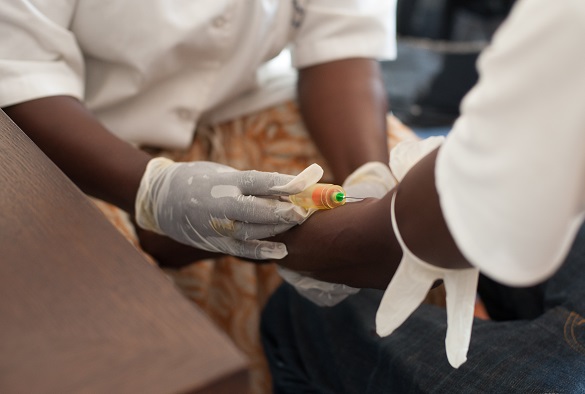 A nurse preps a patient arm for an injection