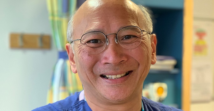 Professor Saye Khoo is smiling into the camera