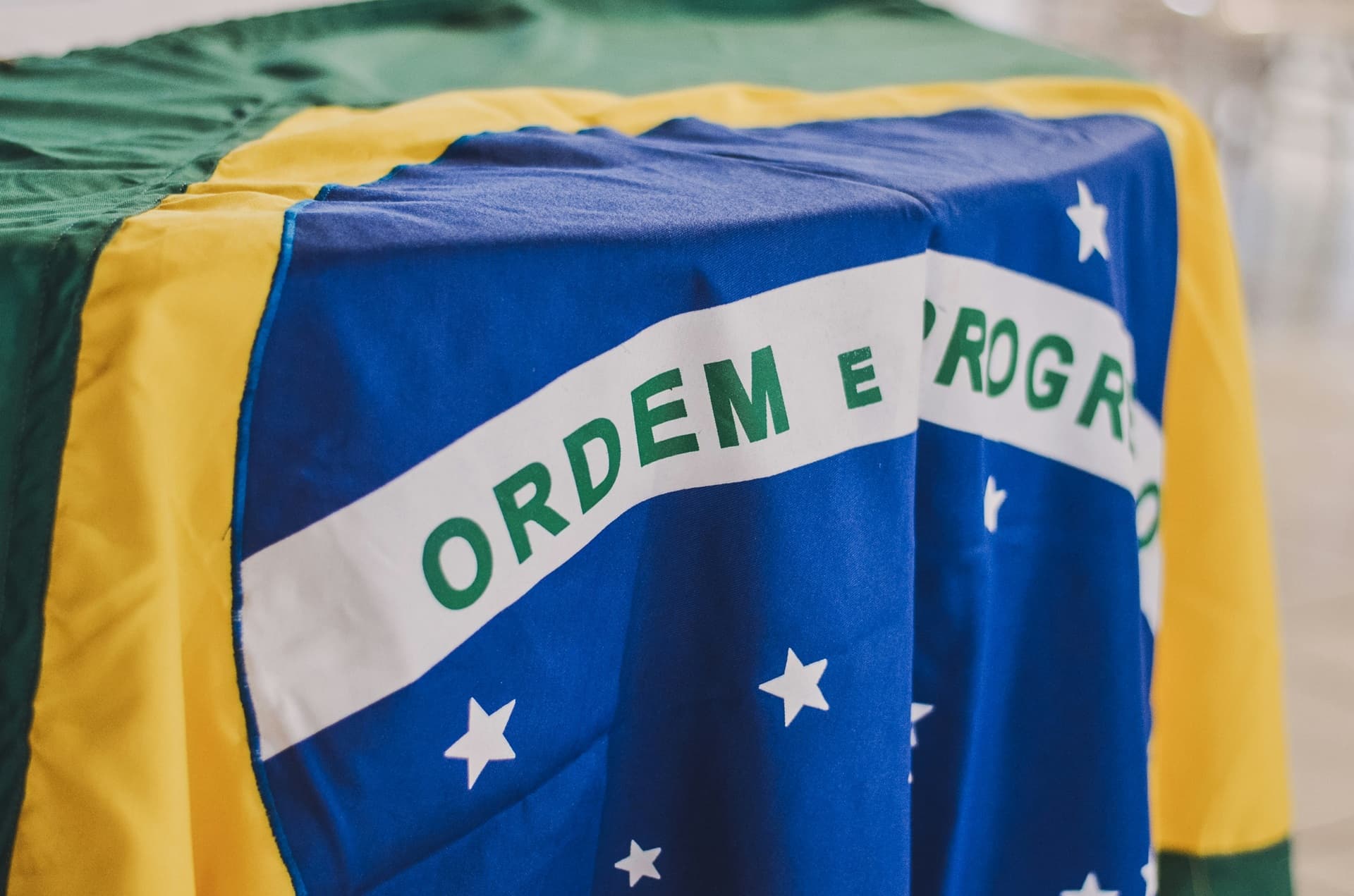 A close up of a Brazil\'s flag on a table
