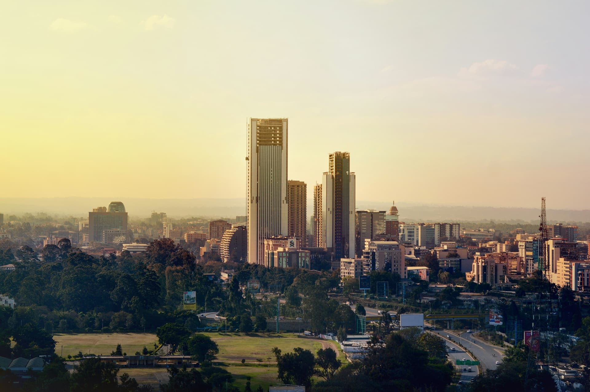 a skyline of Nairobi city in Kenya as the sun rises.
