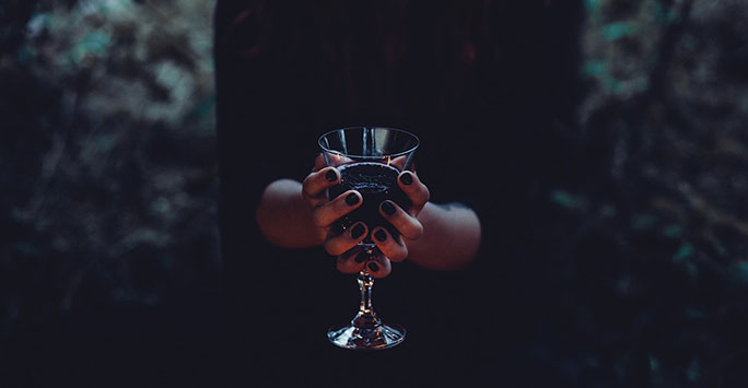 Vampire holding glass