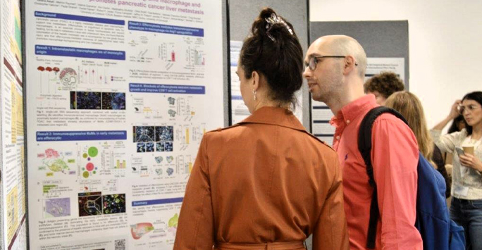 A colleague discusses their research
