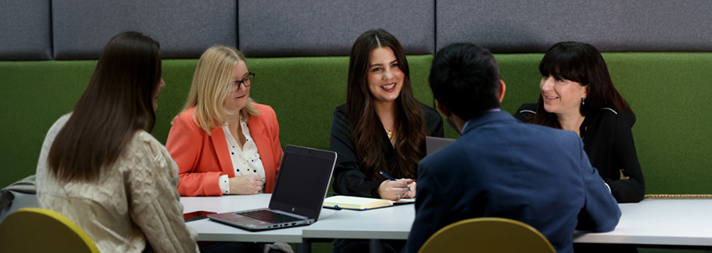 People Talking Around a Desk