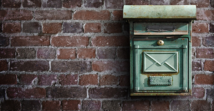 Postbox on wall