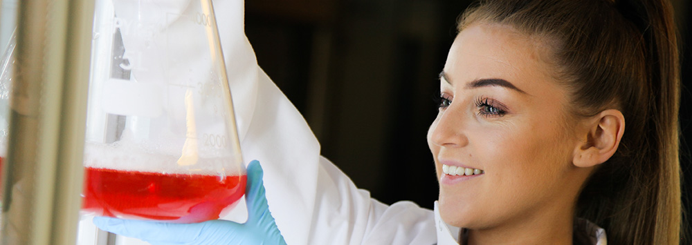 Female PhD student working in lab