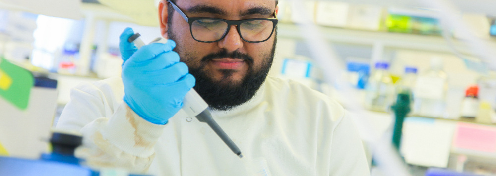 A male scientist working in a lab