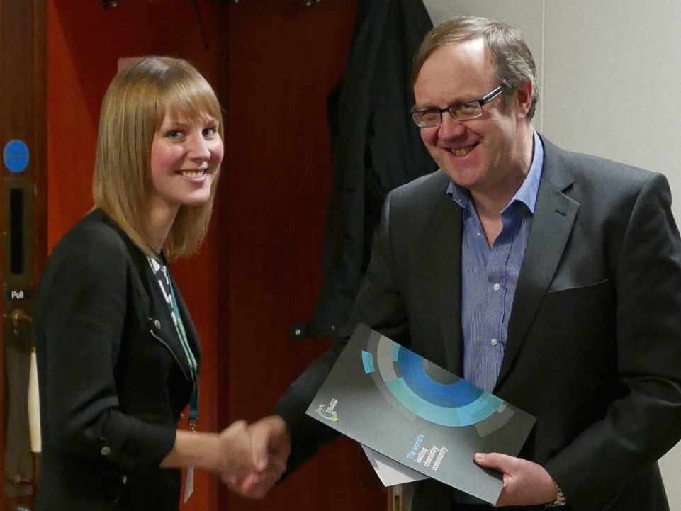Kathryn Price receiving her prize for her talk at the BMCS RSC Postgraduate Symposium