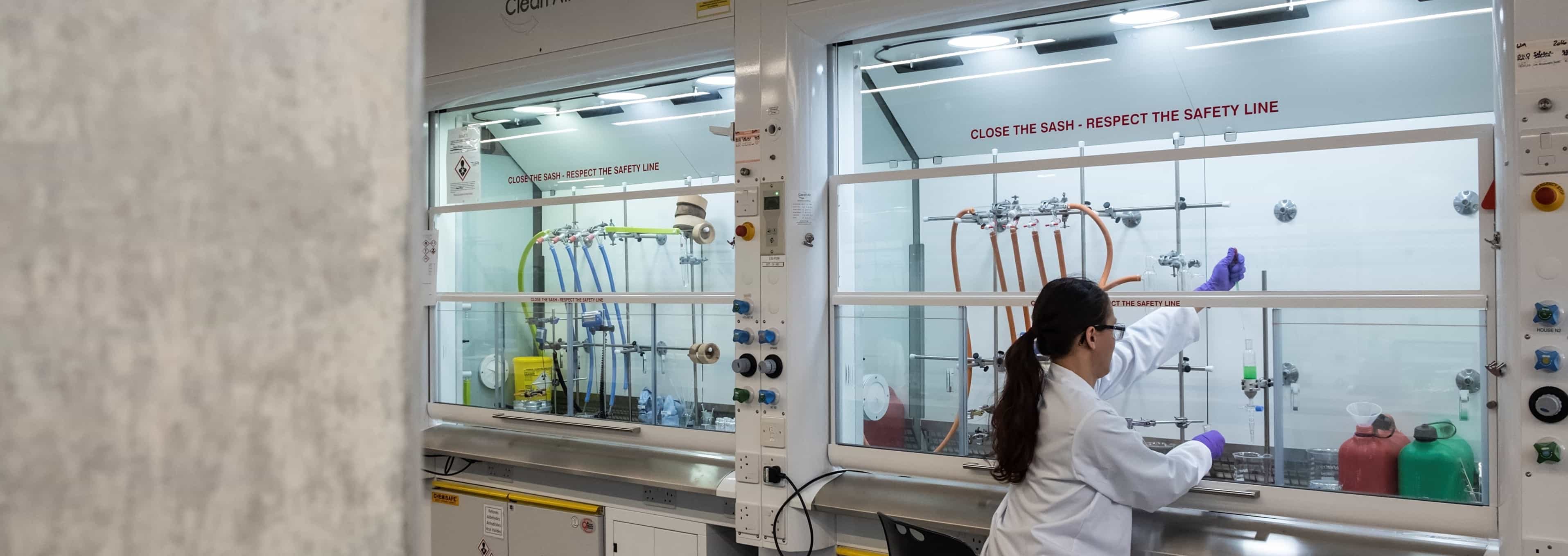 women working in lad operating fumehood