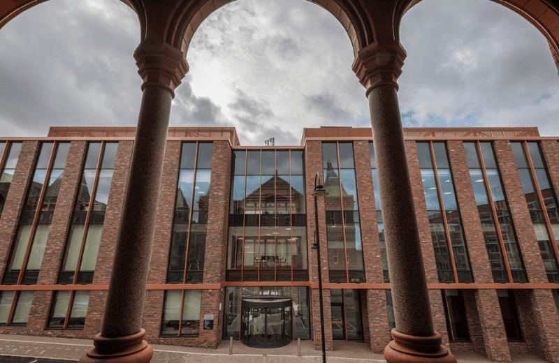 Our Digital Innovation Facility building, made of red brick and large glass windows