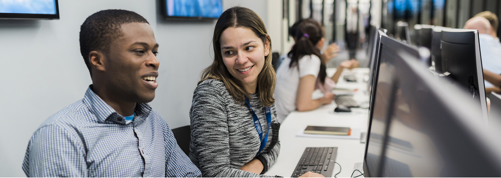 Students sitting at a computer