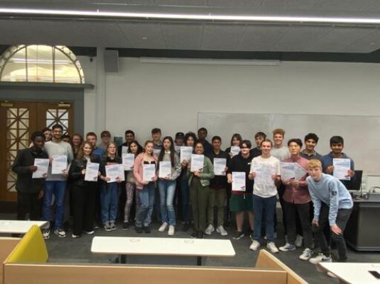 Image of students getting their certificates at the end of the Summer School