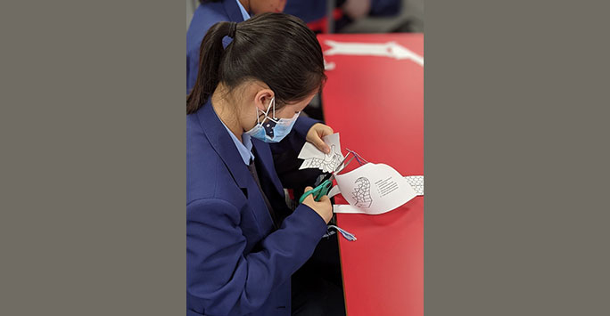 Belvedere student partaking in the China Day craft workshop 