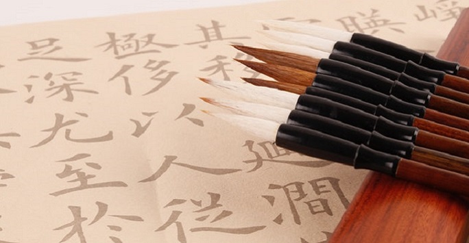 traditional chinese calligraphy set, paintbrushes laying on pad