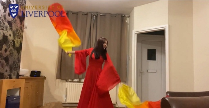 traditional chinese fan dancing, taking place at home via an online lesson