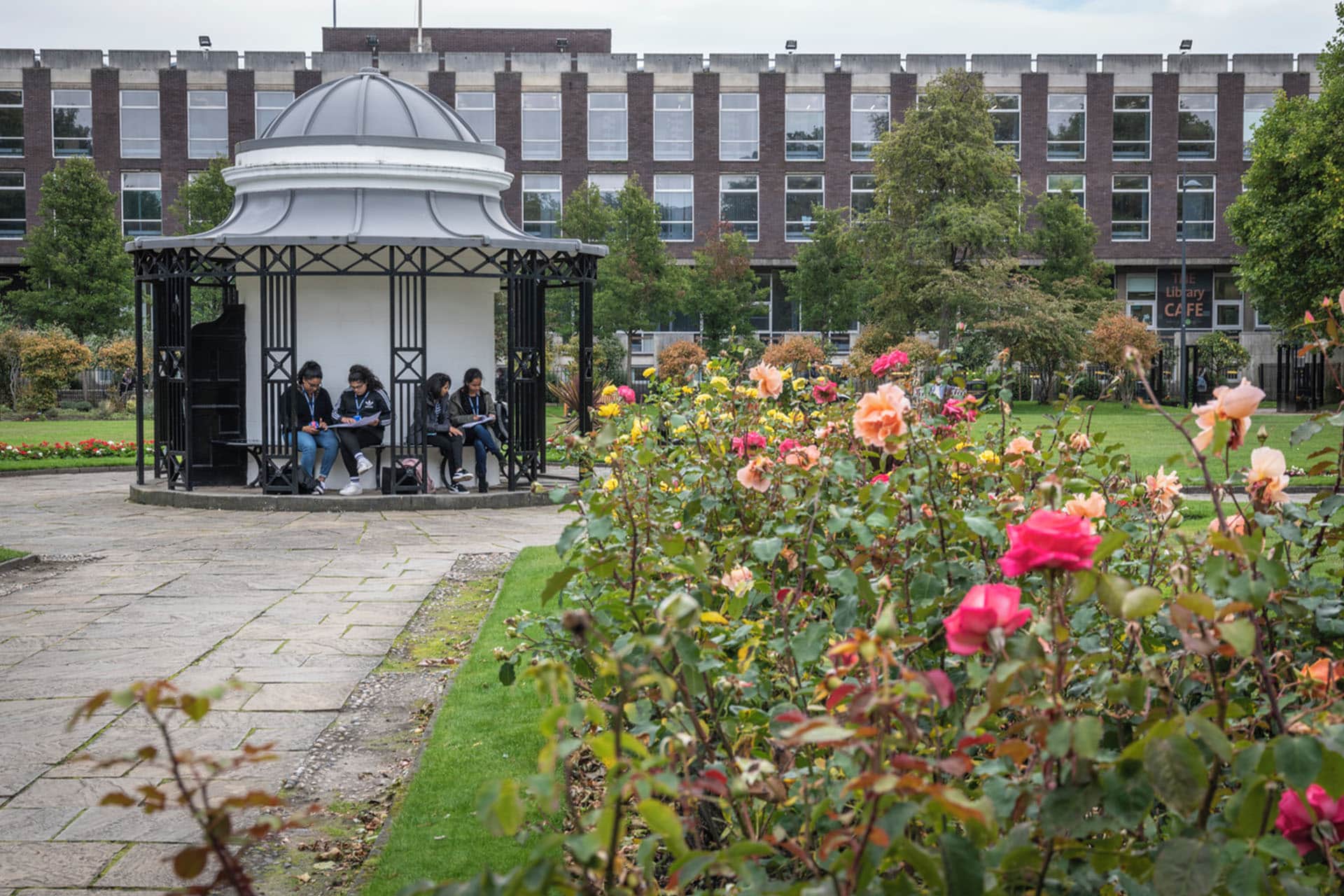 Group of students sitting in pergola in Abercromby Square