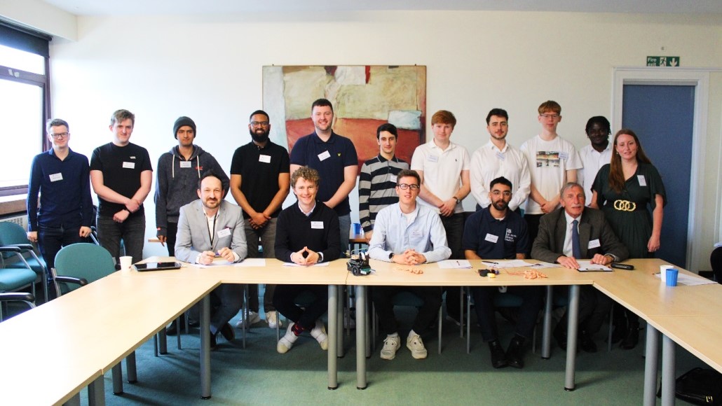 A group picture of final year students with the judges at the Dragons' Den event
