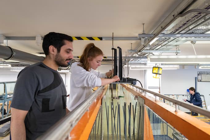 Civil Engineering students using a water flume in the Hydraulics lab