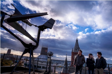 PhD Students with Wind Turbine