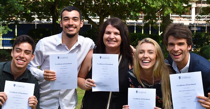 Students holding certificates