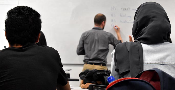 A tutor teaching a class