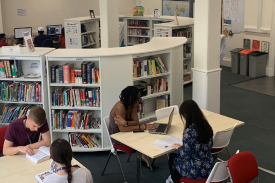 Students working at tables in the Language Lounge