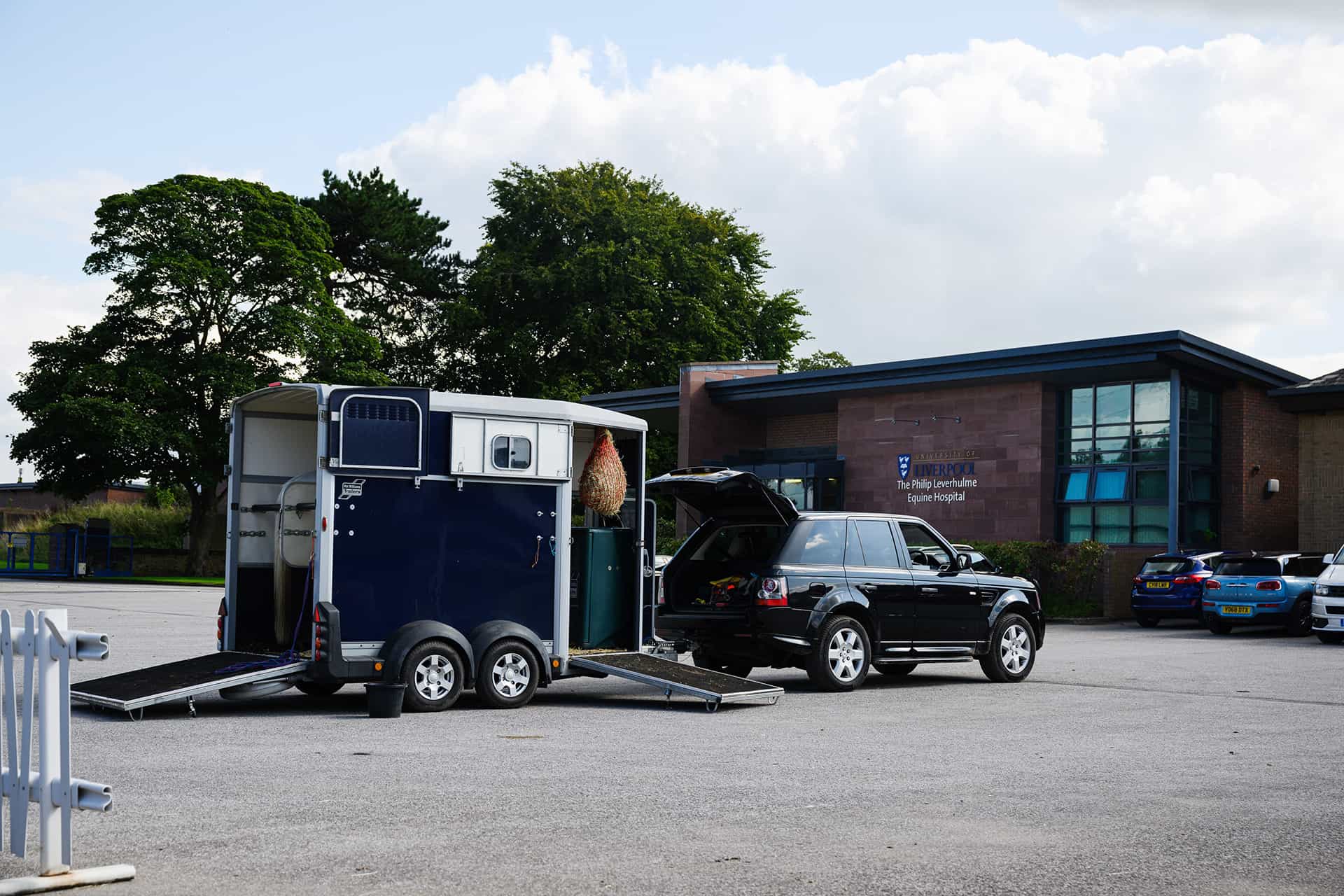 Car pulling horse trailer
