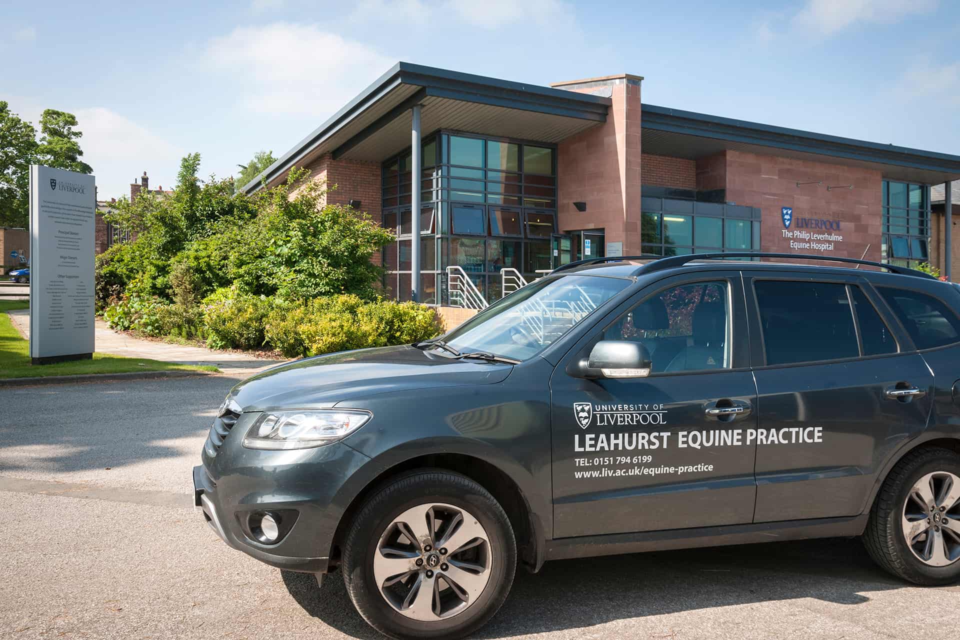 Equine Practice car outside building