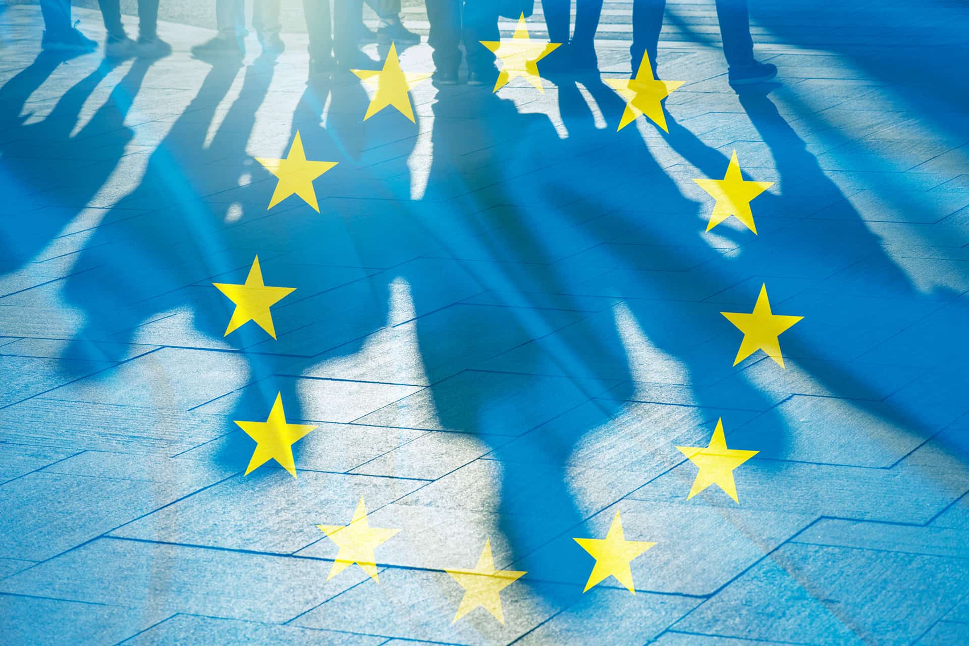 Shadows of people with the European flag overlayed