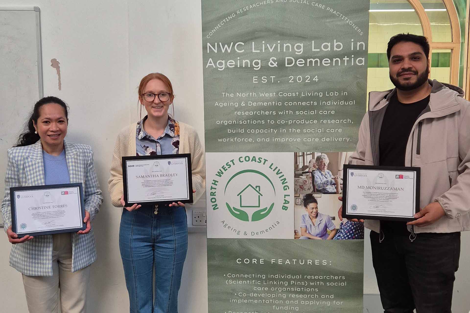 Living lab project interns receive certificates acknowledging a year of successful work