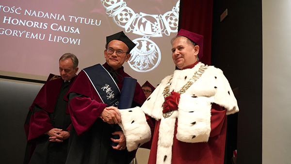 Prof Greg Lip receiving Honorary from Rector