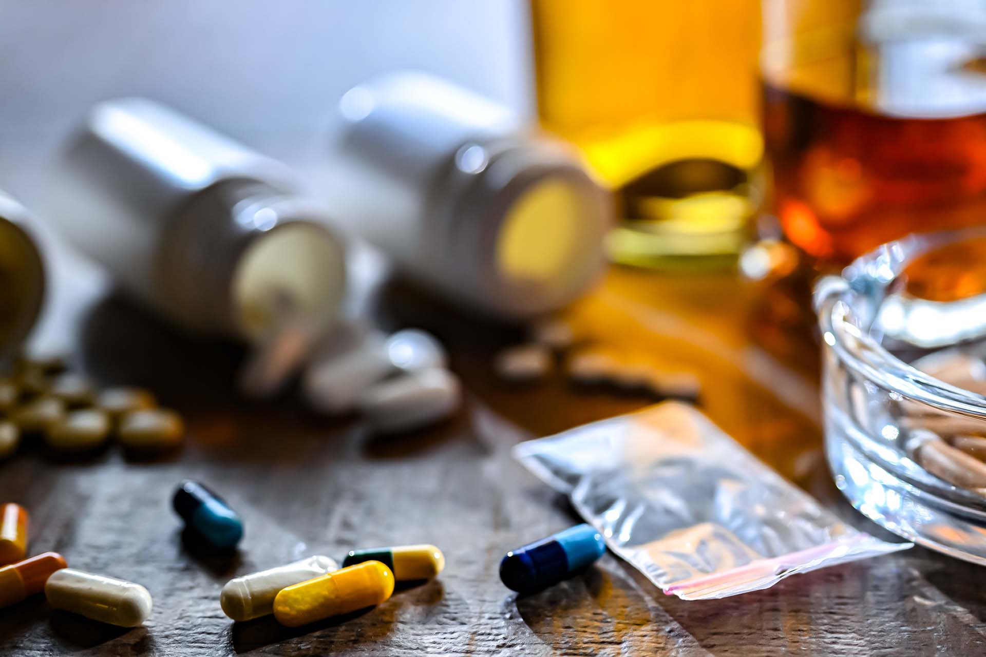 image of collection of drugs and other substances across table