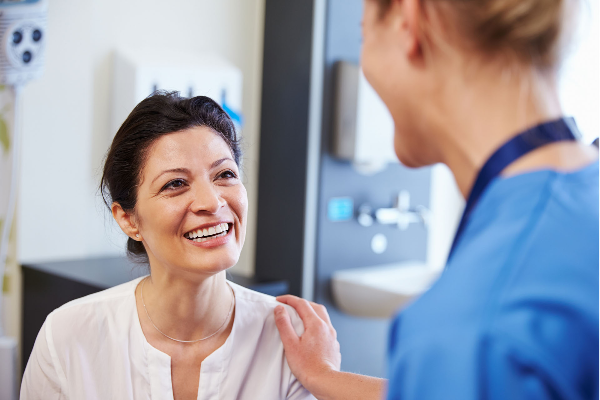 image of nurse tending to elderly female patient