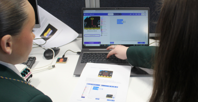 Students from Alsop doing a programming activity on a laptop